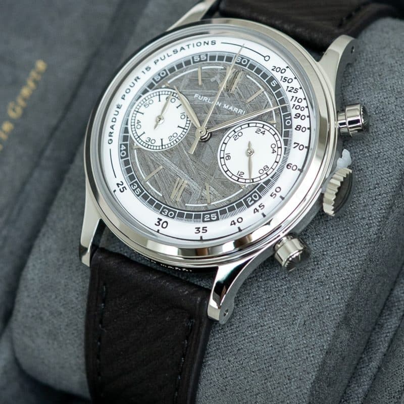 Furlan Marri chronograph with a meteorite dial resting on a grey watch roll